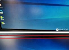 电脑换了显示器上面有黑边怎么解决？